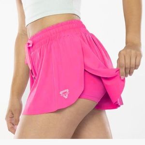 Bright pink keiki Kona flowy shorts with spandex underneath!